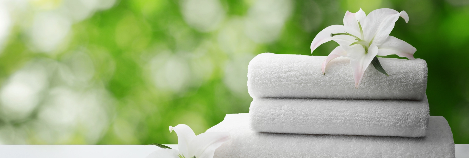 Folded Towels On A Surface 1920X650